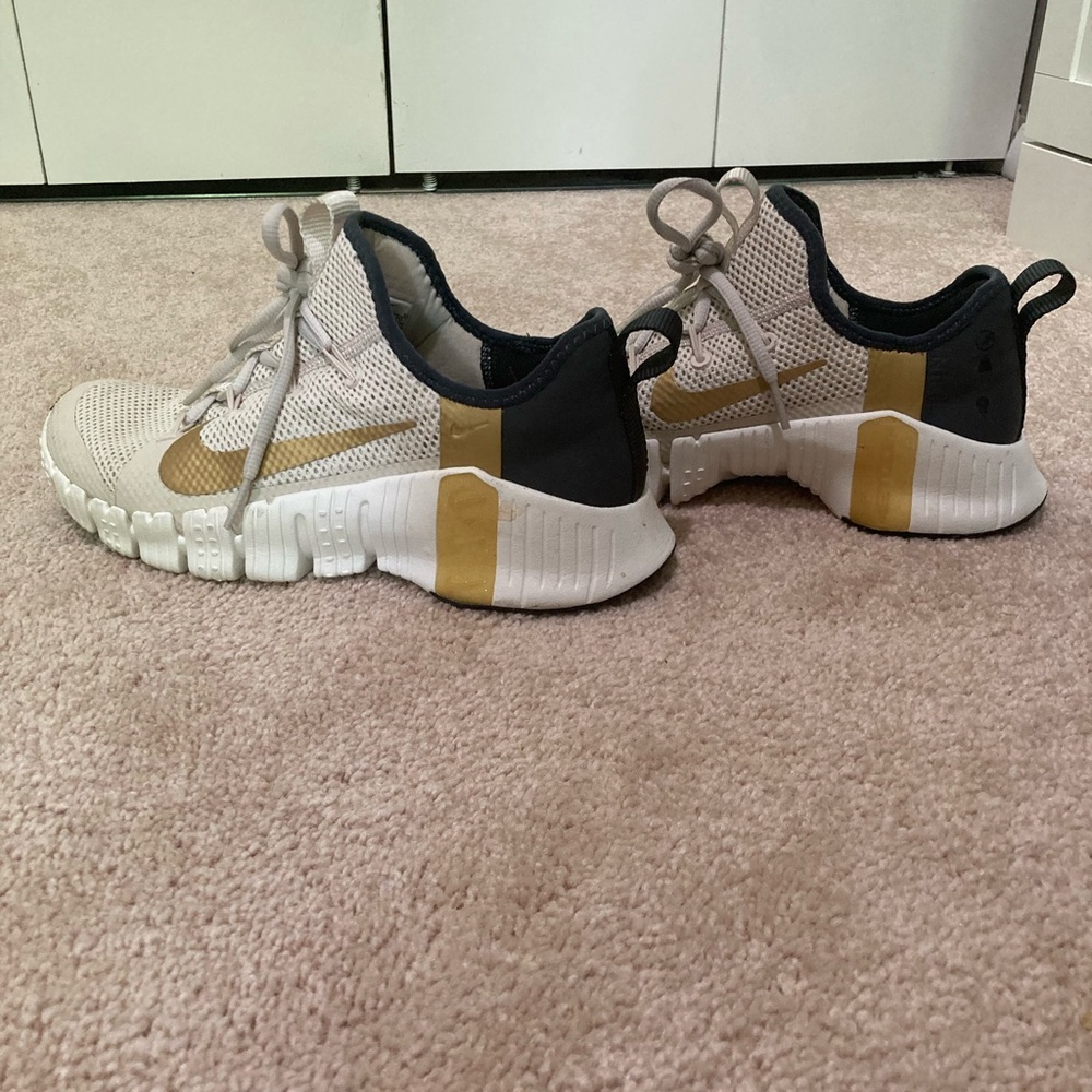 Nike metcons in white and gold